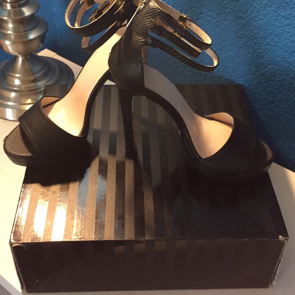 Black open toed heels with gold zip up..